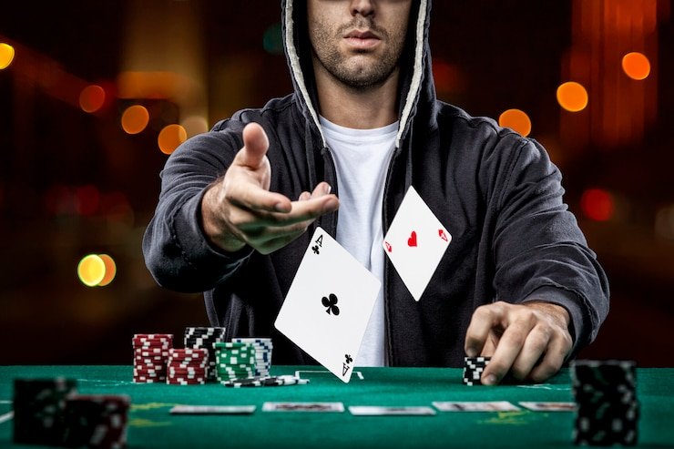 Close-up of card deck and chip stack at live dealer table